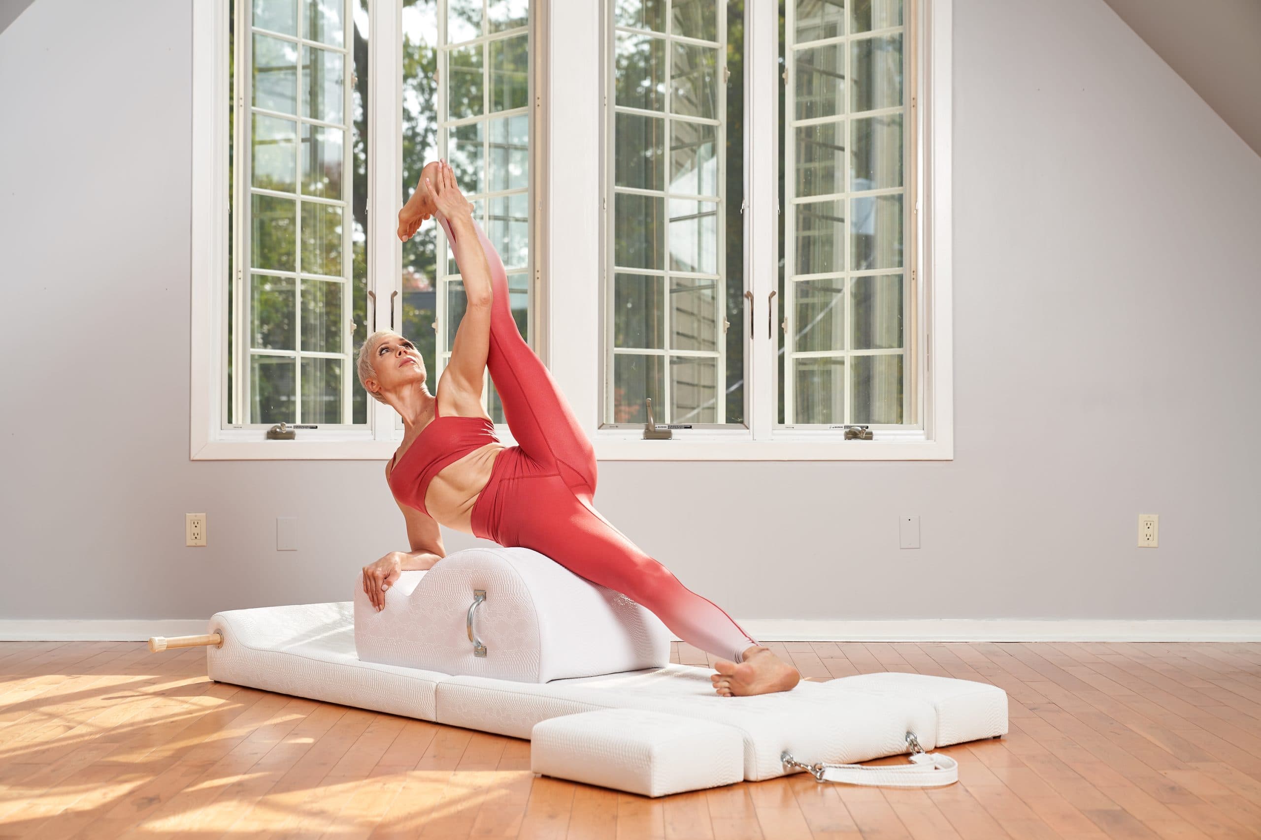 Kathryn Ross Nash performing Pilates on the High Folding Barrel